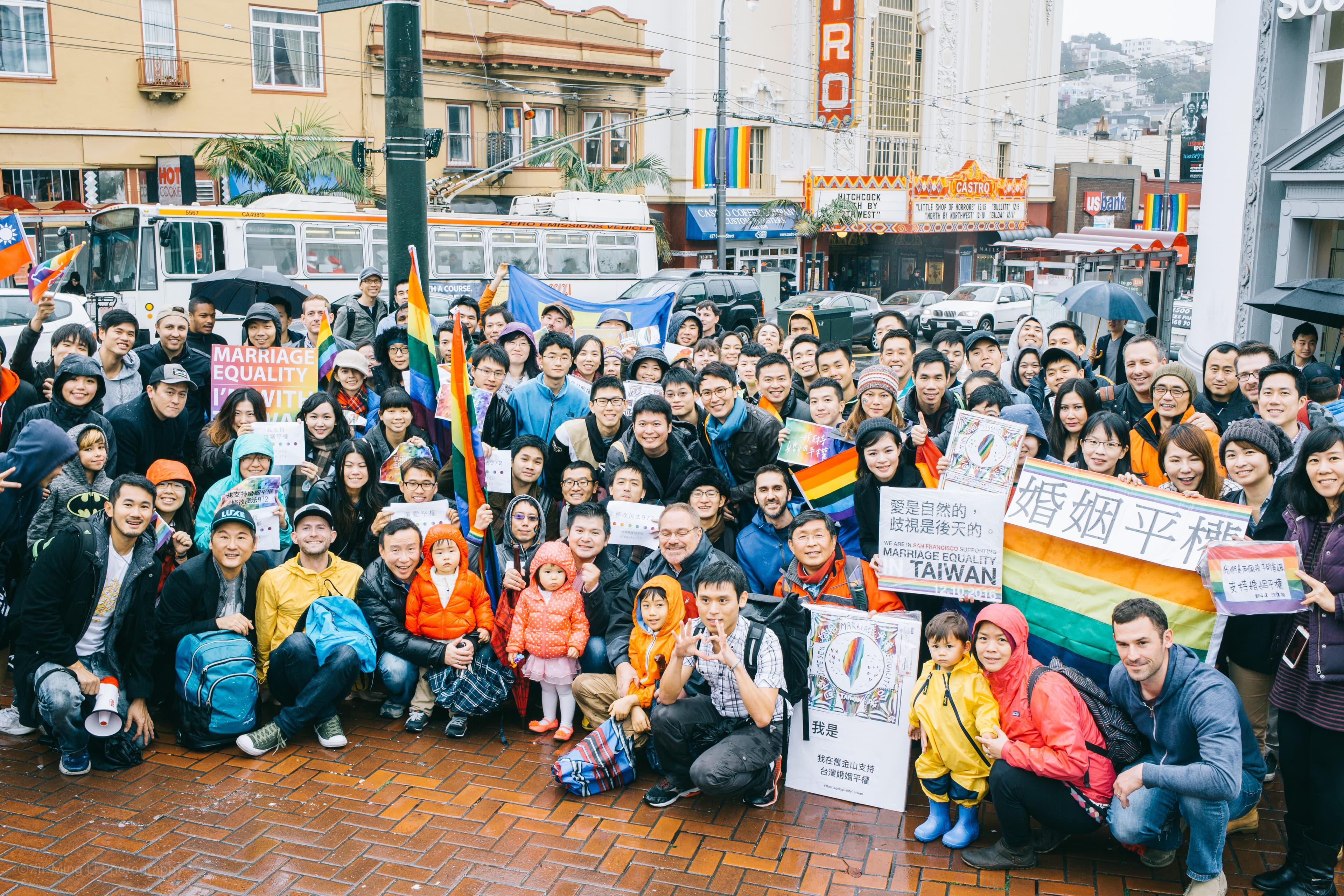 People gathered with Taiwan marriage-equality signs and rainbow flags outside San Francisco's Castro Theatre